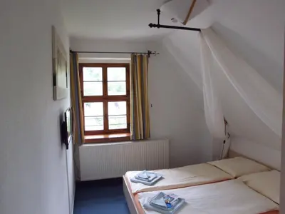 Ein Bett oder Betten in einem Zimmer der Unterkunft Burg Hohnstein