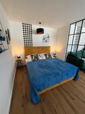 Ein Bett oder Betten in einem Zimmer der Unterkunft ANER 5 elegantes Neustadt Apartment Abby