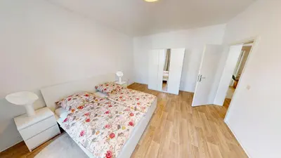 Ein Bett oder Betten in einem Zimmer der Unterkunft Ferienwohnung nahe Industriemuseum, WLAN