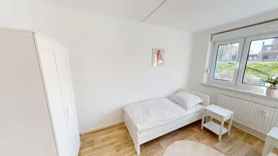 Ein Bett oder Betten in einem Zimmer der Unterkunft Vintage-Flair gemeinsam genießen, ÖPNV fußläufig erreichbar, WLAN