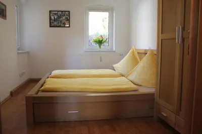 Ein Bett oder Betten in einem Zimmer der Unterkunft Porschdorfer Einkehr