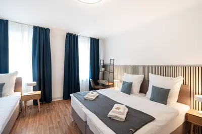 Ein Bett oder Betten in einem Zimmer der Unterkunft Benville Freital - 2 Schlafzimmer - Wohnküche - WLAN