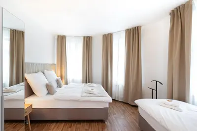 Ein Bett oder Betten in einem Zimmer der Unterkunft Benville Freital - 2 Schlafzimmer - Wohnküche - WLAN