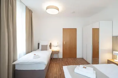 Ein Bett oder Betten in einem Zimmer der Unterkunft Benville Freital - 2 Schlafzimmer - Wohnküche - WLAN