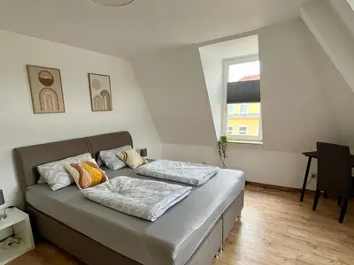 Ein Bett oder Betten in einem Zimmer der Unterkunft Ferienwohnung für 5 Personen