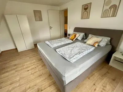 Ein Bett oder Betten in einem Zimmer der Unterkunft Ferienwohnung für 5 Personen