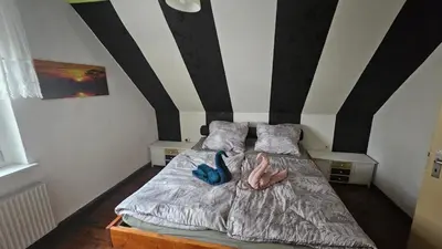 Ein Bett oder Betten in einem Zimmer der Unterkunft Zur Alten Post