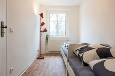 Ein Bett oder Betten in einem Zimmer der Unterkunft Atelierwohnung am Stadtpark