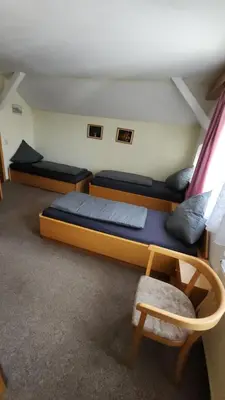 Ein Bett oder Betten in einem Zimmer der Unterkunft Pension 7-Eichen 44