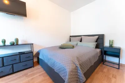 Ein Bett oder Betten in einem Zimmer der Unterkunft City Apartment Dresden