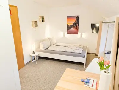 Ein Bett oder Betten in einem Zimmer der Unterkunft L7 - Urlaubsmagie - Kleine Wohnung am Wanderweg