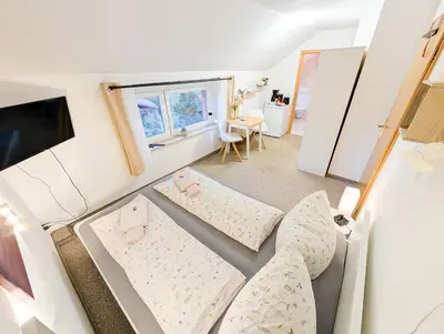 Ein Bett oder Betten in einem Zimmer der Unterkunft L7 - Urlaubsmagie - Kleine Wohnung am Wanderweg