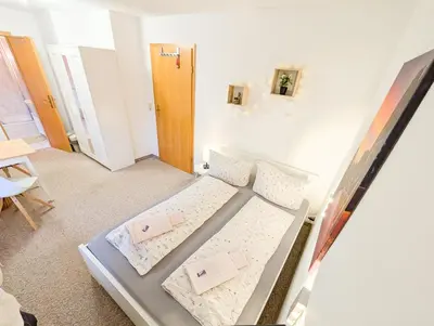 Ein Bett oder Betten in einem Zimmer der Unterkunft L7 - Urlaubsmagie - Kleine Wohnung am Wanderweg