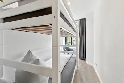 Ein Bett oder Betten in einem Zimmer der Unterkunft DresdenStay gemütlich und modern mit Kamin und PS4