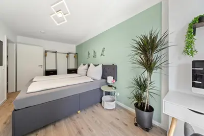 Ein Bett oder Betten in einem Zimmer der Unterkunft DresdenStay gemütlich und modern mit Kamin und PS4