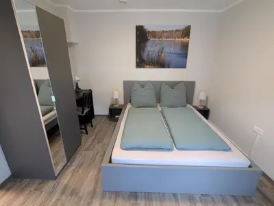 Ein Bett oder Betten in einem Zimmer der Unterkunft Ferienwohnung Sydom