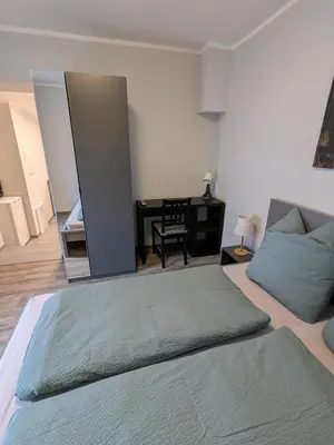 Ein Bett oder Betten in einem Zimmer der Unterkunft Ferienwohnung Sydom