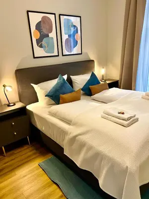 Ein Bett oder Betten in einem Zimmer der Unterkunft Cozy Voyage - Frauenkirche 1 - Zentral und ruhig