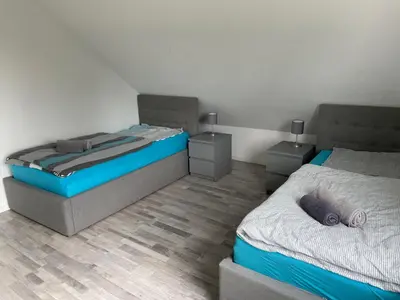 Ein Bett oder Betten in einem Zimmer der Unterkunft Eastside-Apartment WHG 01
