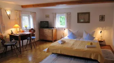 Ein Bett oder Betten in einem Zimmer der Unterkunft Landgasthaus Schwarzbachtal