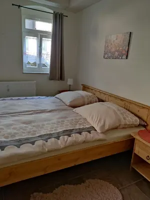 Ein Bett oder Betten in einem Zimmer der Unterkunft Pension Grenzeck Sommerfrische