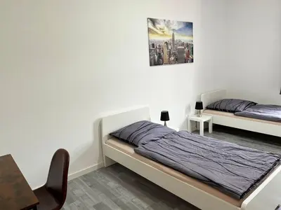 Ein Bett oder Betten in einem Zimmer der Unterkunft Modern Work & Relax Apartment