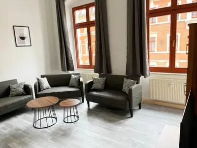 Ein Sitzbereich in der Unterkunft Modern Work & Relax Apartment