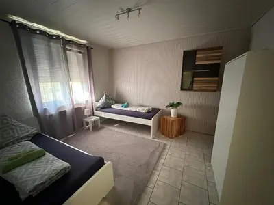 Ein Bett oder Betten in einem Zimmer der Unterkunft Ferienwohnung HY