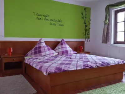 Ein Bett oder Betten in einem Zimmer der Unterkunft 4 JahresZeiten
