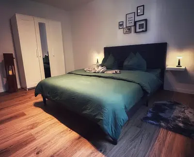 Ein Bett oder Betten in einem Zimmer der Unterkunft Quartier Apartment - alte Steigerbaude