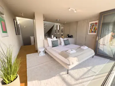Ein Bett oder Betten in einem Zimmer der Unterkunft Penthouse Deluxe I Dachterrasse I Parkplatz