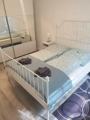 Ein Bett oder Betten in einem Zimmer der Unterkunft Ferienwohnung am Tharandter Wald