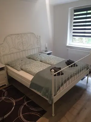 Ein Bett oder Betten in einem Zimmer der Unterkunft Ferienwohnung am Tharandter Wald