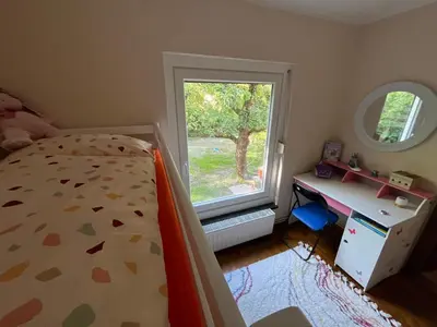 Ein Bett oder Betten in einem Zimmer der Unterkunft Ferienhäuschen Landidyll