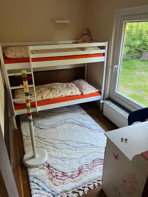 Ein Bett oder Betten in einem Zimmer der Unterkunft Ferienhäuschen Landidyll