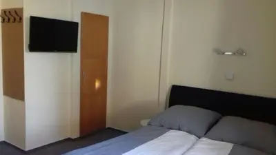 Ein Bett oder Betten in einem Zimmer der Unterkunft Pension Altwahnsdorf
