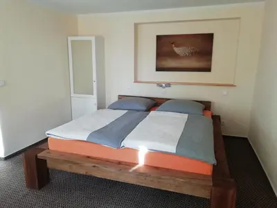 Ein Bett oder Betten in einem Zimmer der Unterkunft Pension Altwahnsdorf