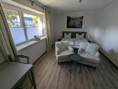 Ein Sitzbereich in der Unterkunft Ferienwohnung Dorfaue