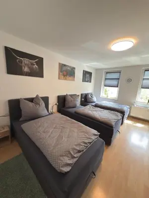 Ein Bett oder Betten in einem Zimmer der Unterkunft Am Stadtrand