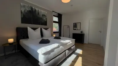Ein Bett oder Betten in einem Zimmer der Unterkunft Fernblick - Ferienwohnung mit Bastei-Aussicht
