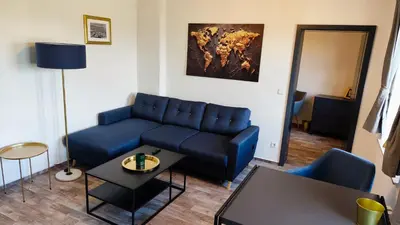 Ein Sitzbereich in der Unterkunft Golden Hop Apartments