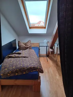 Ein Bett oder Betten in einem Zimmer der Unterkunft Stadtvilla Nichterlein - Ferienwohnung Nr 12