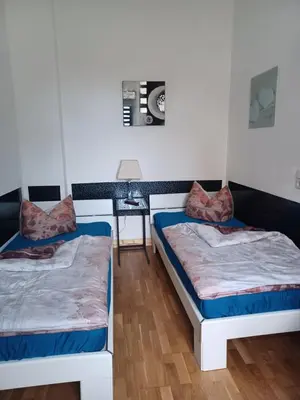 Ein Bett oder Betten in einem Zimmer der Unterkunft Stadtvilla Nichterlein - Ferienwohnung Nr 3