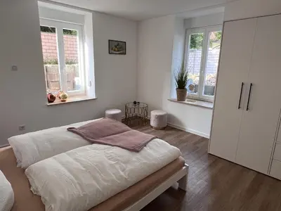 Ein Bett oder Betten in einem Zimmer der Unterkunft Trompeten-, Posaunen- & Tuba-Appartment in Stolpen