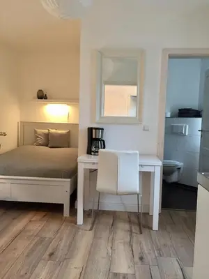 Ein Bett oder Betten in einem Zimmer der Unterkunft Kleines Ferienappartement 3 im Schmöllerhäuschen