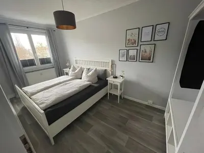 Ein Bett oder Betten in einem Zimmer der Unterkunft Charming 4-Person Apartment in Hoyerswerda City Center