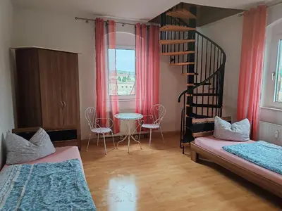 Ein Bett oder Betten in einem Zimmer der Unterkunft Elbe Quartier Meißen Wohnung 13
