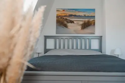 Ein Bett oder Betten in einem Zimmer der Unterkunft One4Five Apartments, Strandhaus, gemütliches Wohnen in Dresden