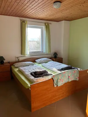 Ein Bett oder Betten in einem Zimmer der Unterkunft Ferienwohnung Am Lilienstein