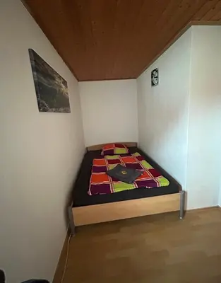 Ein Bett oder Betten in einem Zimmer der Unterkunft Ferienwohnung Am Lilienstein